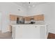 Open kitchen with stainless steel appliances, breakfast bar, and neutral finishes at 920 Serpentina Ave, Las Vegas, NV 89123