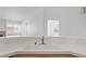 Kitchen sink and breakfast bar overlook a spacious and bright living area at 920 Serpentina Ave, Las Vegas, NV 89123