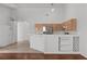 Kitchen featuring wooden cabinets, and modern stainless steel refrigerator at 920 Serpentina Ave, Las Vegas, NV 89123