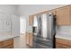 Kitchen featuring stainless steel refrigerator and ample cabinet space at 920 Serpentina Ave, Las Vegas, NV 89123