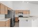 Well-equipped kitchen featuring stainless steel appliances and light wood cabinetry at 920 Serpentina Ave, Las Vegas, NV 89123