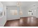 Bright living room boasts hardwood floors, neutral paint, and large windows at 920 Serpentina Ave, Las Vegas, NV 89123
