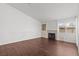 Bright living room with wood floors, fireplace, and large windows at 920 Serpentina Ave, Las Vegas, NV 89123