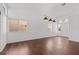 Bright living room featuring hardwood floors, two large windows and pendant lights at 920 Serpentina Ave, Las Vegas, NV 89123