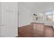 Spacious living room with vaulted ceilings and hardwood flooring and a large door frame at 920 Serpentina Ave, Las Vegas, NV 89123