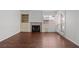 Bright living room featuring a fireplace, wood floors, and natural light at 920 Serpentina Ave, Las Vegas, NV 89123