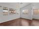 Inviting living room with hardwood floors and ample natural light from large windows at 920 Serpentina Ave, Las Vegas, NV 89123