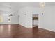 Open living space with hardwood floors, neutral walls, and modern pendant lighting at 920 Serpentina Ave, Las Vegas, NV 89123