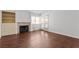 Spacious living room offering hardwood floors, natural light, built-in shelving and fireplace at 920 Serpentina Ave, Las Vegas, NV 89123