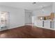 Living room with wood floors that flows into the kitchen and outdoor access at 920 Serpentina Ave, Las Vegas, NV 89123
