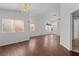 Open and airy living room with hardwood floors, plenty of windows and modern light fixtures at 920 Serpentina Ave, Las Vegas, NV 89123