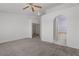 Spacious carpeted main bedroom with ceiling fan, walk-in closet, and ensuite bath with large soaking tub at 920 Serpentina Ave, Las Vegas, NV 89123