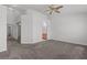 Bright main bedroom featuring neutral walls, plush carpeting, and an ensuite bath with ample space at 920 Serpentina Ave, Las Vegas, NV 89123
