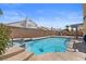 Inviting backyard pool with a built-in spa, perfect for relaxation and outdoor entertaining at 920 Serpentina Ave, Las Vegas, NV 89123