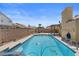 A full view of the in-ground pool and backyard at 920 Serpentina Ave, Las Vegas, NV 89123