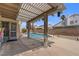 View of a backyard pool, patio, and privacy wall at 920 Serpentina Ave, Las Vegas, NV 89123