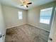 Comfortable bedroom featuring soft carpeting, natural light from two windows, and neutral colored walls at 9348 Wildcat Peak St, Las Vegas, NV 89178