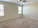 Neutral bedroom with carpet, ceiling fan, and natural light from windows, creating a comfortable and relaxing atmosphere at 9348 Wildcat Peak St, Las Vegas, NV 89178