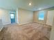 Spacious bonus room with neutral carpet, window and access to other rooms at 9348 Wildcat Peak St, Las Vegas, NV 89178