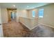 Upstairs hallway with neutral carpet and light-colored walls, providing access to various rooms with a bright, airy feel at 9348 Wildcat Peak St, Las Vegas, NV 89178