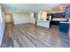 Open-concept kitchen features stainless steel appliances, a large island, and dark cabinetry at 9348 Wildcat Peak St, Las Vegas, NV 89178