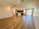 Inviting open-concept living space featuring wood flooring and a kitchen with an island, offering modern living and functionality at 9348 Wildcat Peak St, Las Vegas, NV 89178