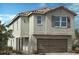 Charming two-story home featuring a tile roof, neutral stucco and a welcoming two-car garage at 9564 Hinson St, Las Vegas, NV 89102