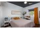 Bright bedroom with dark ceiling, a large window, and a cozy bed with plush pillows at , North Las Vegas, NV 89031