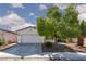 Charming single-story home featuring a well-manicured yard and inviting curb appeal with mature trees at , North Las Vegas, NV 89031