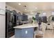 Open kitchen features a large island, stainless steel appliances, and stylish gray cabinetry at , North Las Vegas, NV 89031