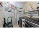 Well-organized laundry room with modern washer and dryer and charming decor at , North Las Vegas, NV 89031
