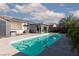 Backyard pool with clear water, a shed, and a covered patio area with comfortable seating at , North Las Vegas, NV 89031