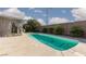 Inviting pool with a tanning ledge, surrounded by lush greenery and a block wall at , North Las Vegas, NV 89031