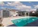 Backyard pool with clear water, a shed, and a covered patio area with comfortable seating at , North Las Vegas, NV 89031