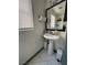 Small bathroom with pedestal sink at 10265 Moth Orchid Ct, Las Vegas, NV 89183