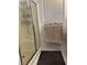 Shower stall with glass door and white tiling at 10265 Moth Orchid Ct, Las Vegas, NV 89183