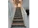 Stairway with decorative patterned risers at 10265 Moth Orchid Ct, Las Vegas, NV 89183
