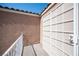 Charming patio area with tiled flooring and access to the interior, offering privacy at 10414 Midseason Mist St, Las Vegas, NV 89183