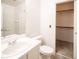 Bathroom with a clean white sink and vanity, with tiled shower and walk-in closet at 10414 Midseason Mist St, Las Vegas, NV 89183