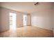 Spacious bedroom with wood floors, multiple doorways, and access to closet and bathroom at 10414 Midseason Mist St, Las Vegas, NV 89183