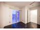 Bedroom featuring access to outdoor patio and a walk-in closet in a well-lit space at 10414 Midseason Mist St, Las Vegas, NV 89183