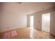 Bright bedroom featuring hardwood floors, leading to an ensuite bathroom and walk-in closet at 10414 Midseason Mist St, Las Vegas, NV 89183