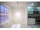 Bright dining area adjoins kitchen with natural light and tile floors at 10414 Midseason Mist St, Las Vegas, NV 89183