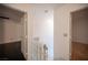 Hallway with view of two rooms divided by a glass brick partition at 10414 Midseason Mist St, Las Vegas, NV 89183