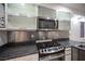 Kitchen with stainless steel appliances, gas range, and granite counters at 10414 Midseason Mist St, Las Vegas, NV 89183