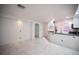 Open concept kitchen with sleek cabinetry, stainless steel appliances, and marble tile flooring at 10414 Midseason Mist St, Las Vegas, NV 89183