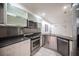 Beautiful kitchen with stainless steel appliances and white cabinets at 10414 Midseason Mist St, Las Vegas, NV 89183