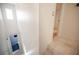 Bright staircase leading to a basement bathroom with blue tiled floors and a hallway on the right at 10414 Midseason Mist St, Las Vegas, NV 89183