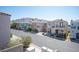 Street view of a residential neighborhood with colorful, well-maintained homes at 10414 Midseason Mist St, Las Vegas, NV 89183