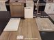 Close-up showcasing kitchen materials, including cabinets, countertops, faucet, and flooring samples at 1536 Little Penguin St, Las Vegas, NV 89138